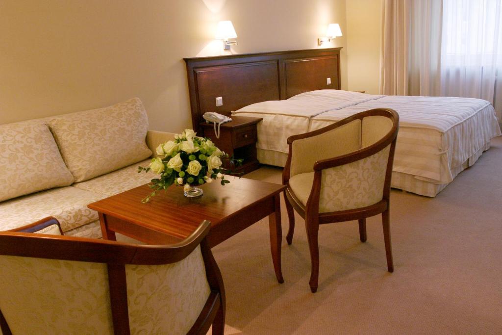 Łóżko lub łóżka w pokoju w obiekcie Hotel Prezydencki 3-star