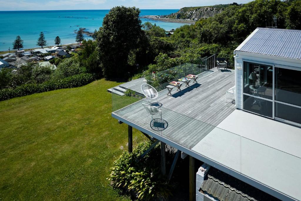 an aerial view of a house with a deck at Expansive Views, Spacious, Large Yard - KK24113 in Kaikoura