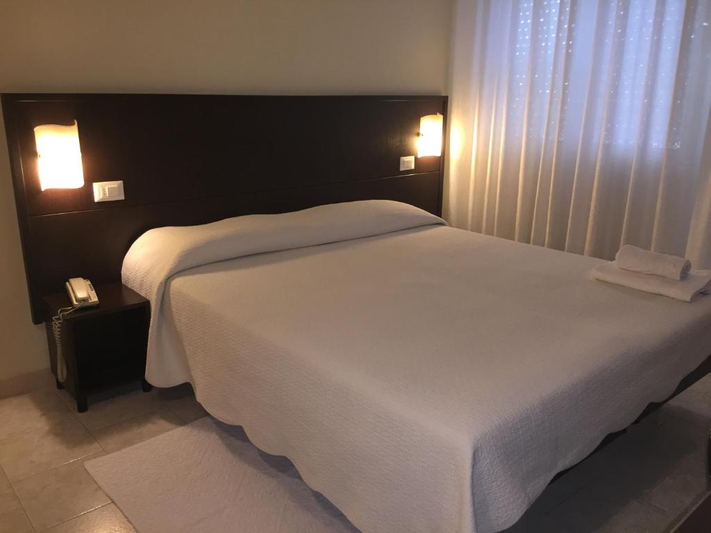 Posteľ alebo postele v izbe v ubytovaní Hotel Okinawa