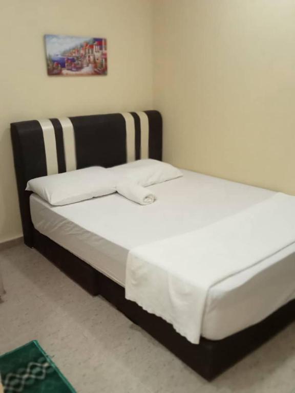 Postel nebo postele na pokoji v ubytování RAS Hotel