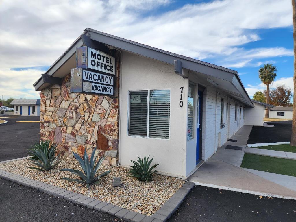 a building with a sign on the side of it at Chandler Inn in Chandler