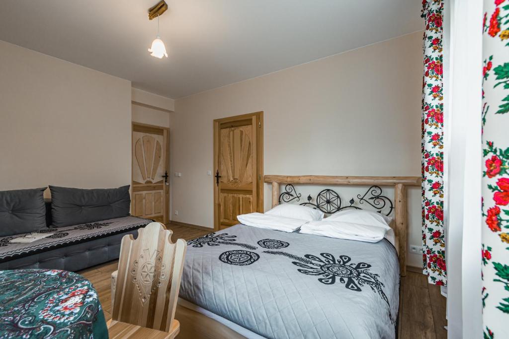 Posteľ alebo postele v izbe v ubytovaní Widokówka Tatry Pokoje i Apartamenty