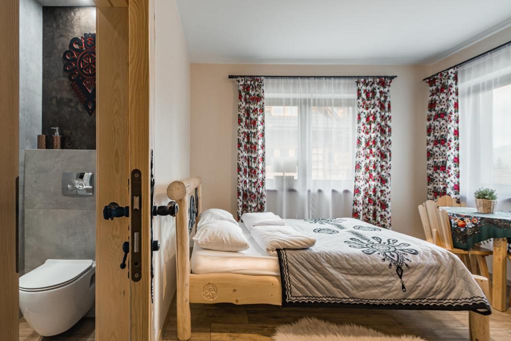 Posteľ alebo postele v izbe v ubytovaní Widokówka Tatry Pokoje i Apartamenty