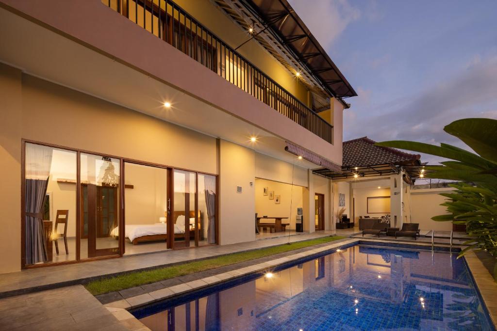 an image of a villa with a swimming pool at Villa Destino - Seminyak Bali in Seminyak