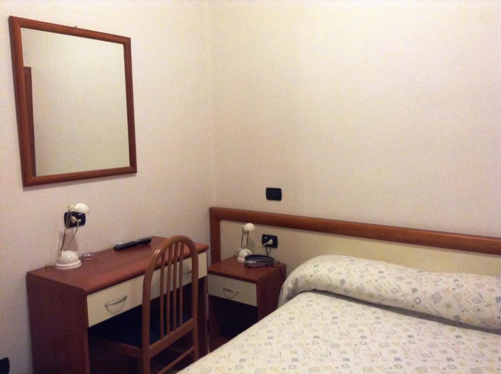 Postel nebo postele na pokoji v ubytování Hotel Ricci