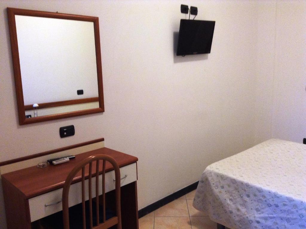 Postel nebo postele na pokoji v ubytování Hotel Ricci