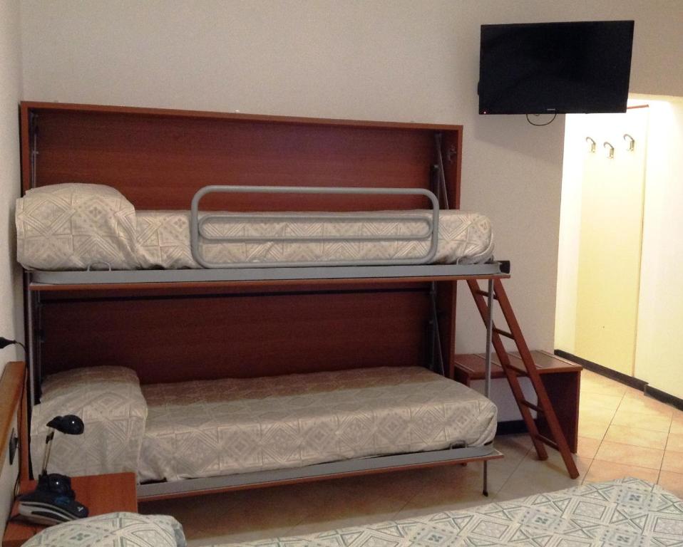 Postel nebo postele na pokoji v ubytování Hotel Ricci