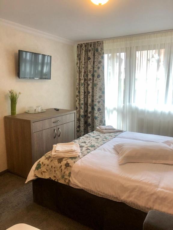 Voodi või voodid majutusasutuse BUCEGI VIEW APARTAMENT toas