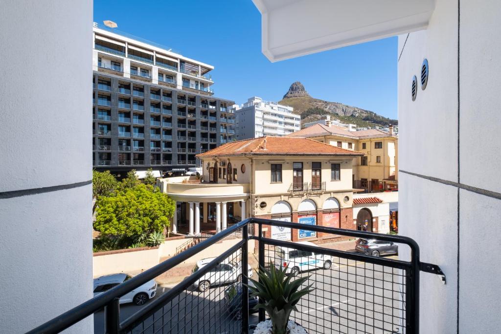 a balcony with a view of a city at The Flamingo Private Apartments by Perch Stays in Cape Town