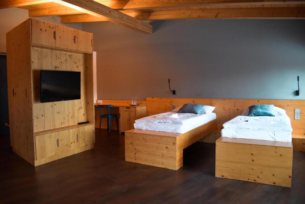 Postel nebo postele na pokoji v ubytování Pivovar Kocour