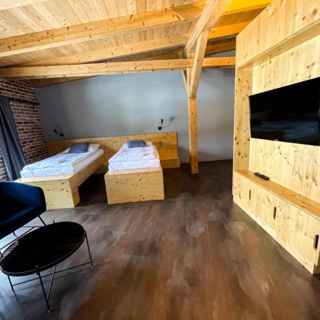 Postel nebo postele na pokoji v ubytování Pivovar Kocour