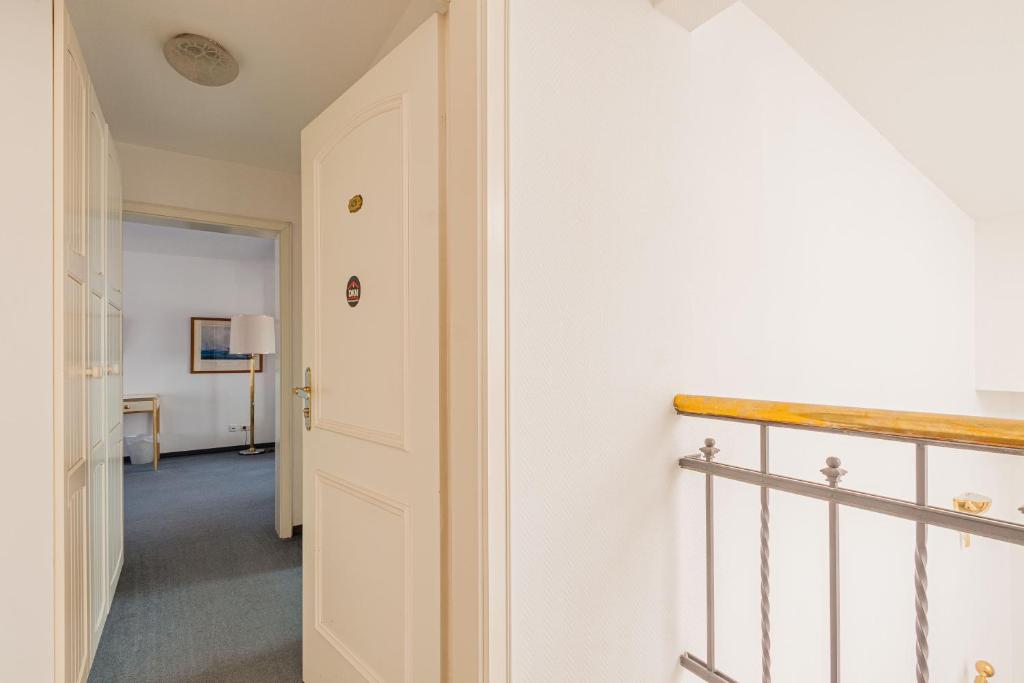 Postel nebo postele na pokoji v ubytování Pension für Monteure in Dresden, Zimmer mit eigenem Bad und großer Gemeinschaftsküche