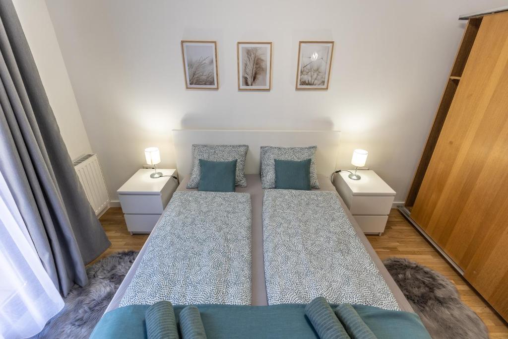 Posteľ alebo postele v izbe v ubytovaní Pleasure Place Apartment