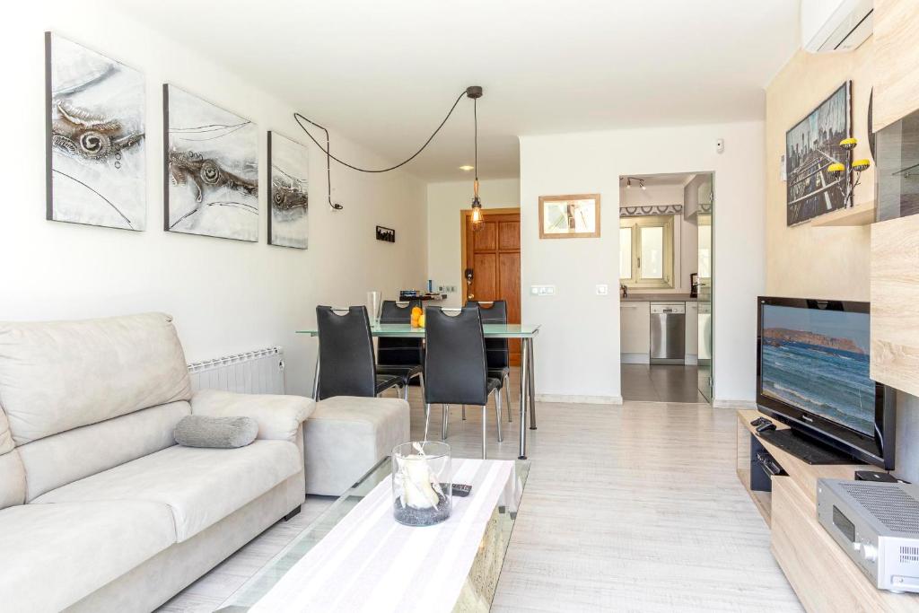 a living room with a couch and a table at VISTA MONTE II - Francisca in El Port