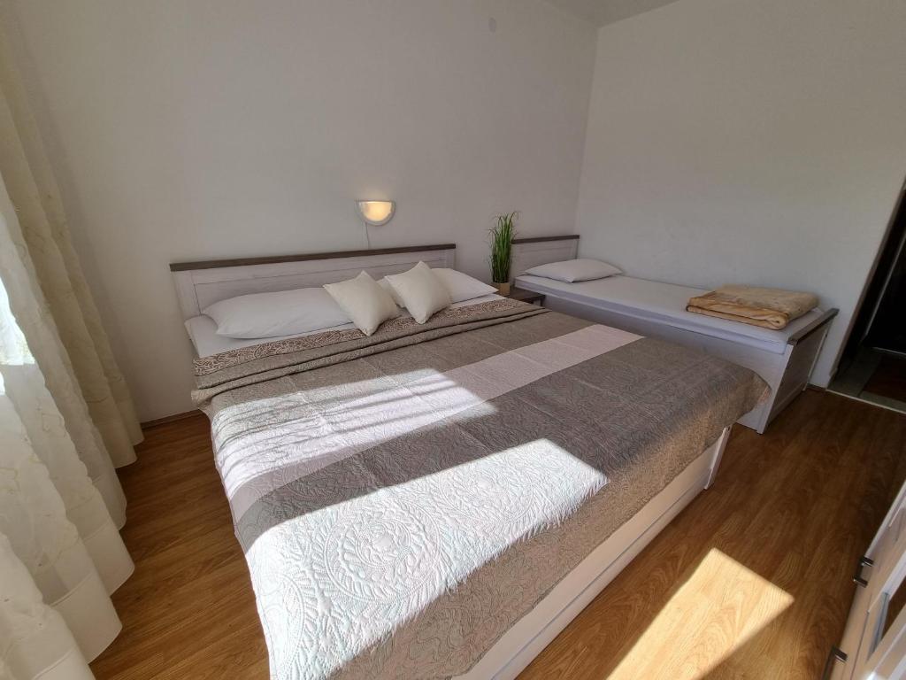 Posteľ alebo postele v izbe v ubytovaní Apartments CHIARA