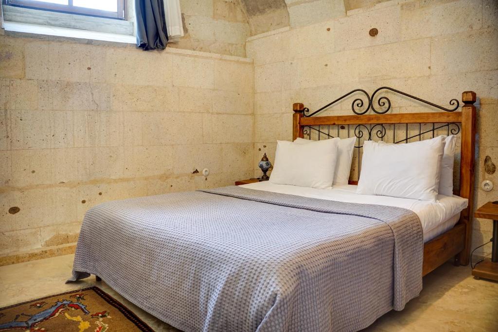 Postel nebo postele na pokoji v ubytování Karma Cappadocia