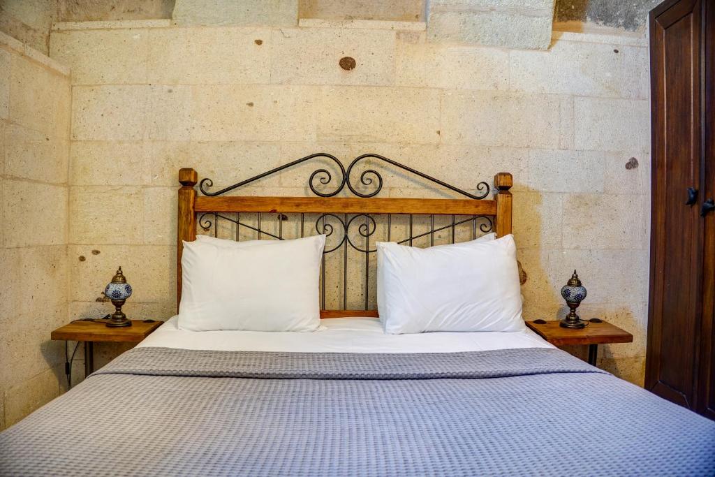 Postel nebo postele na pokoji v ubytování Karma Cappadocia