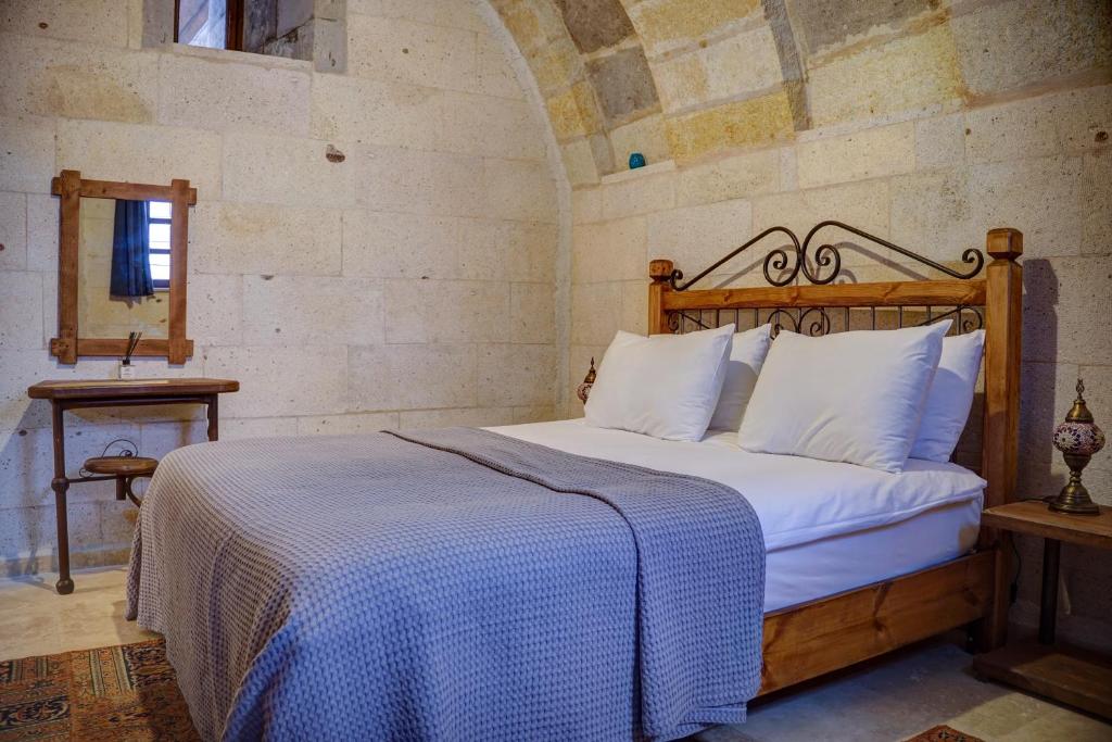 Postel nebo postele na pokoji v ubytování Karma Cappadocia