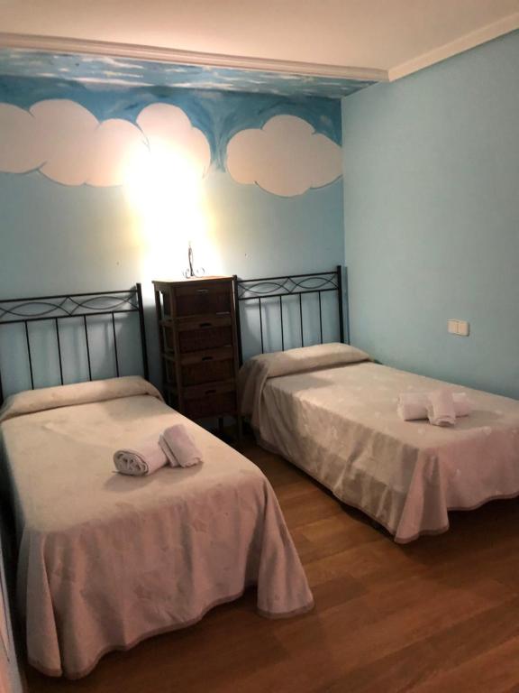 Postel nebo postele na pokoji v ubytování Apartamentos Nicaragua