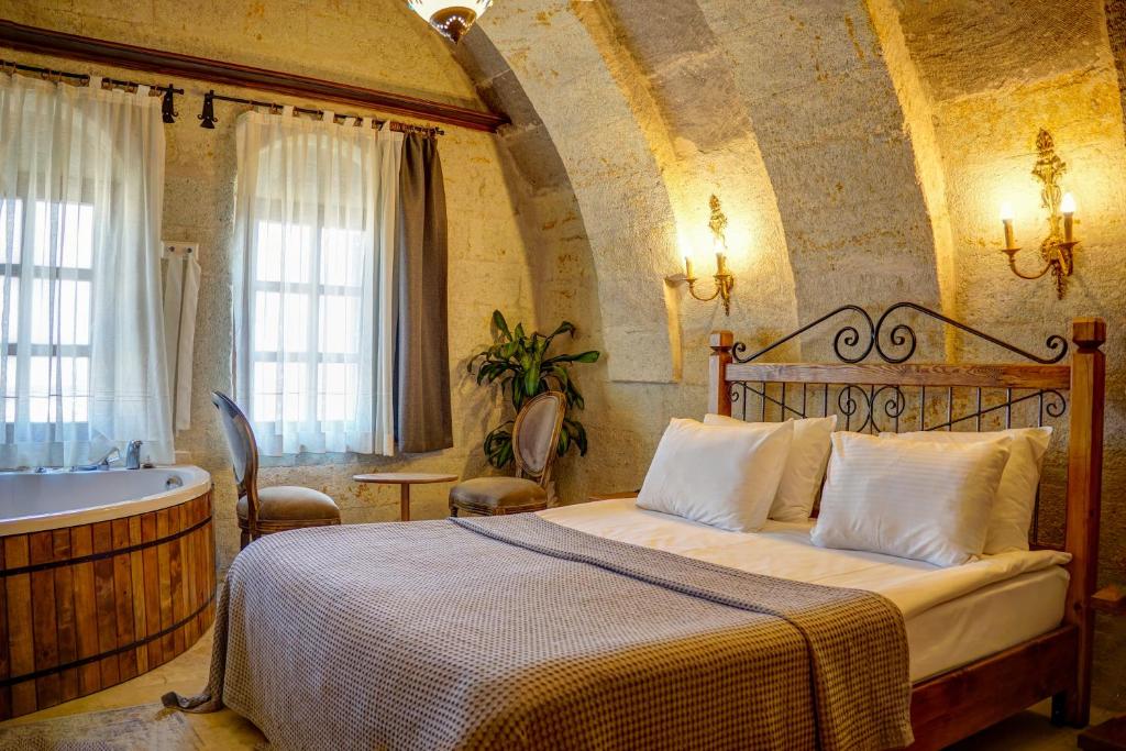 Postel nebo postele na pokoji v ubytování Karma Cappadocia