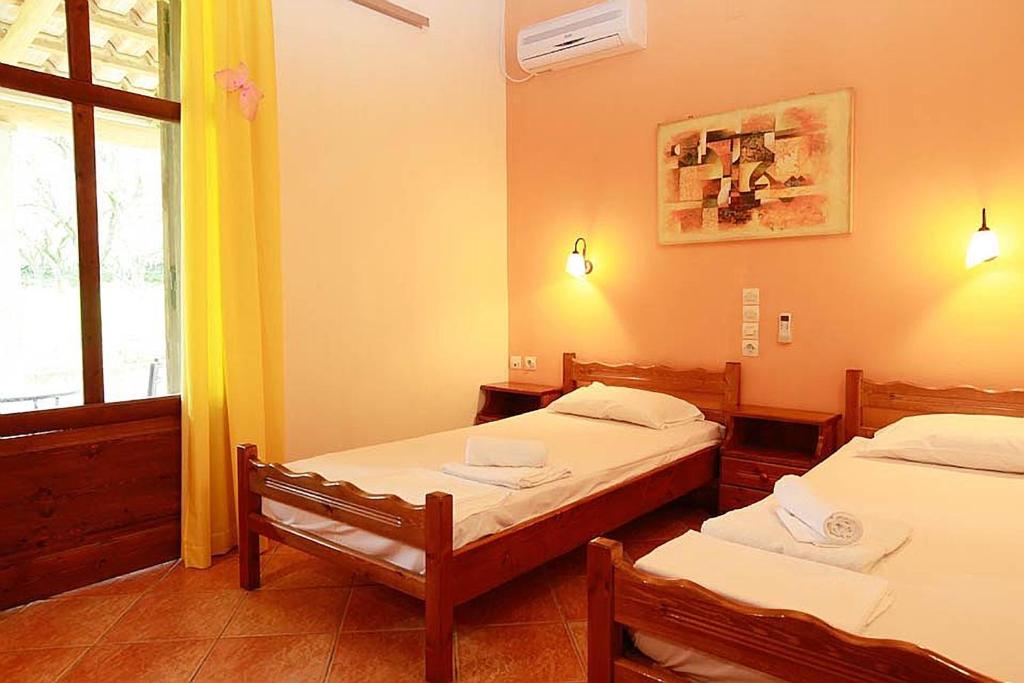 Postel nebo postele na pokoji v ubytování Yannis' Village