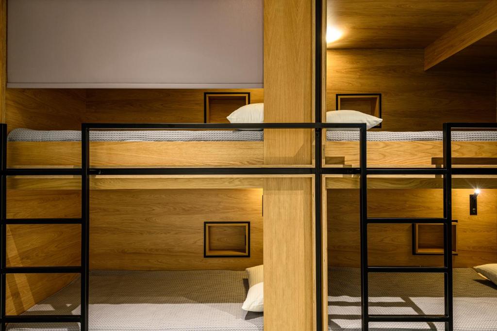 a bunk bed room with two bunk beds at Mosaikon Glostel in Athens