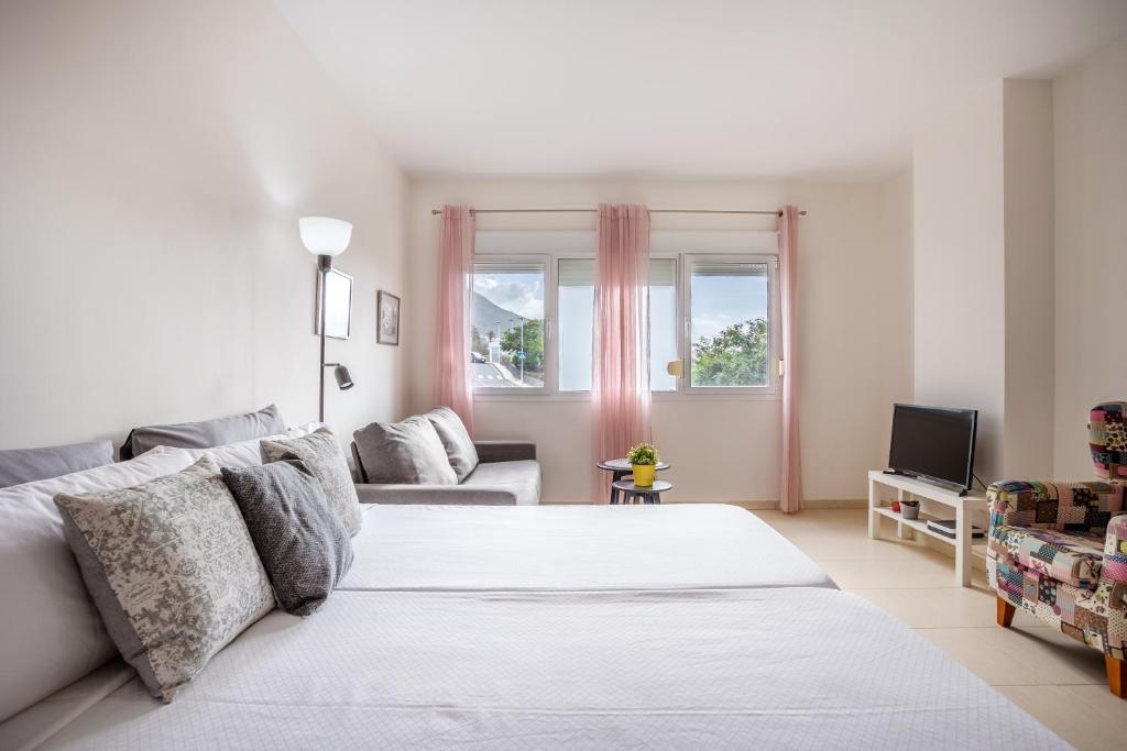 Ένα ή περισσότερα κρεβάτια σε δωμάτιο στο Home2Book Peaceful Getaway in Bajamar