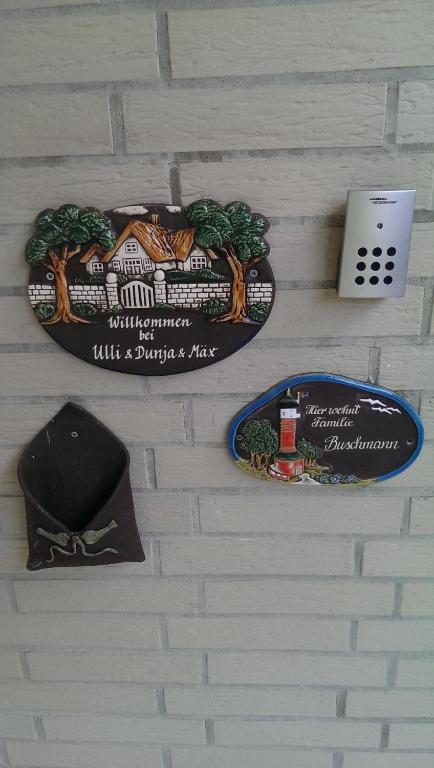 two plates on a wall with a train on it at Villa Duli in Bad Harzburg