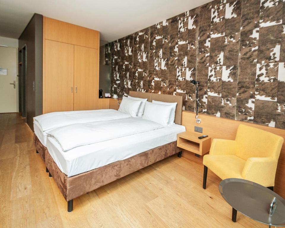 Postel nebo postele na pokoji v ubytování Tailormade Hotel SIHLPARK Schindellegi
