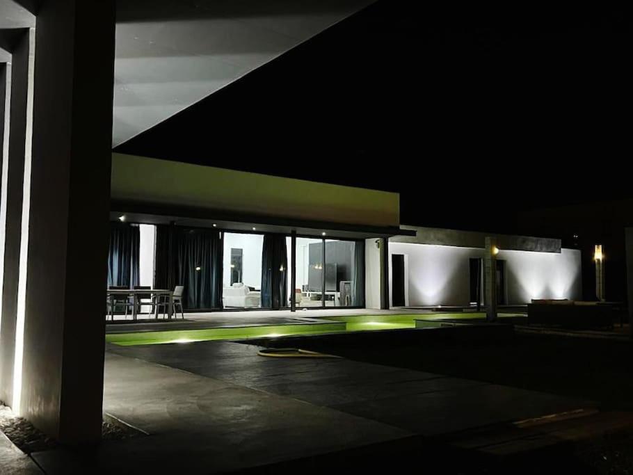 a night view of a building with a patio at Luxury House del Delta in Deltebre