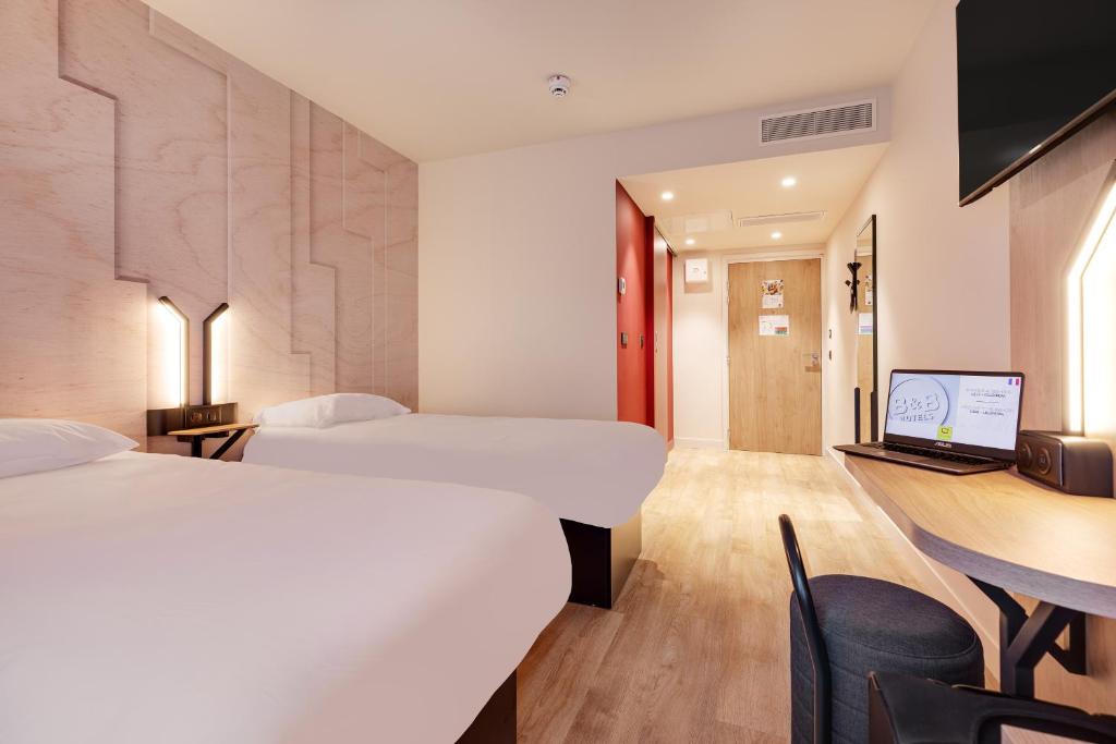 Postel nebo postele na pokoji v ubytování B&B HOTEL Lille Lillenium Eurasanté