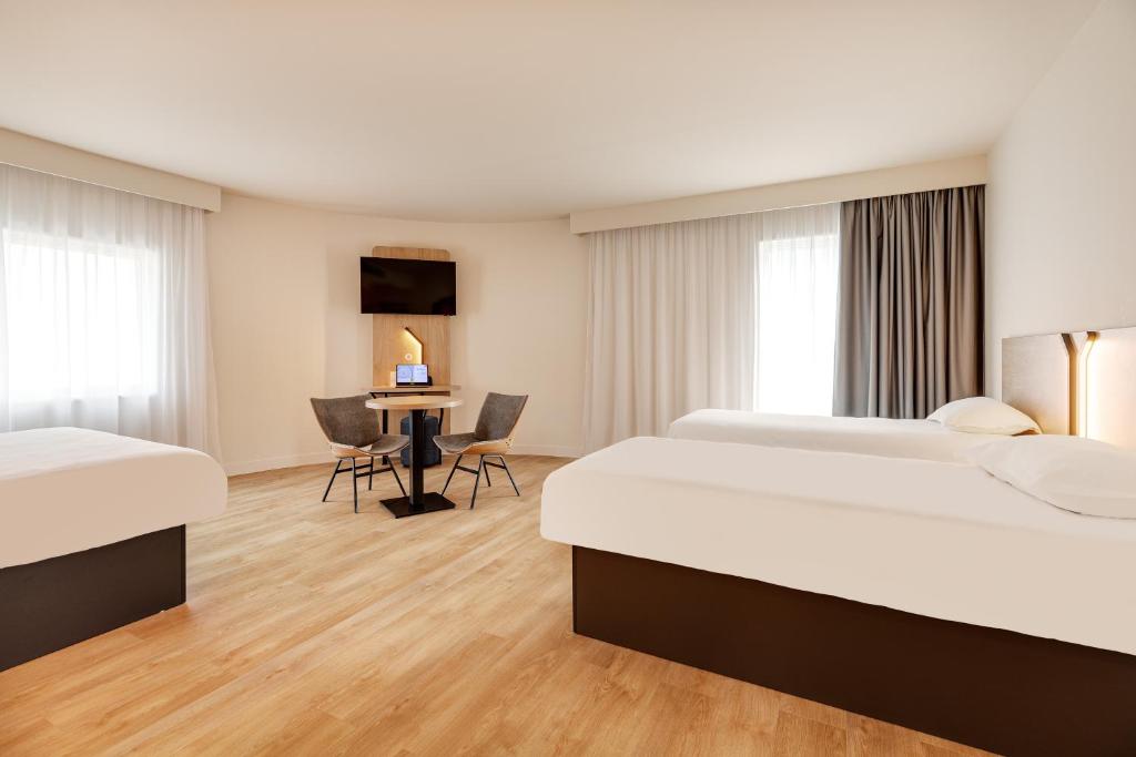 Postel nebo postele na pokoji v ubytování B&B HOTEL Lille Lillenium Eurasanté