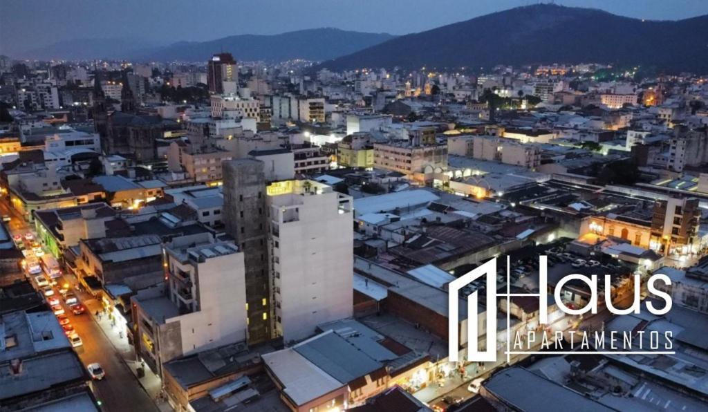 a view of a city at night at HAUS APARTAMENTOS in Salta