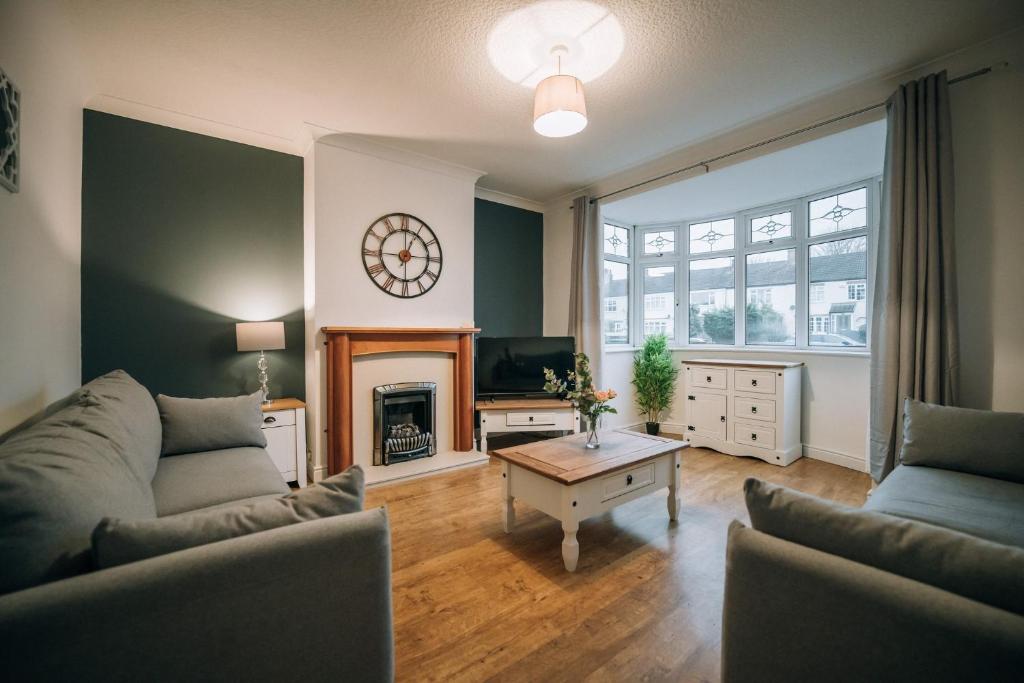 a living room with a couch and a fireplace at Norton Village View By Horizon Stays in Stockton-on-Tees
