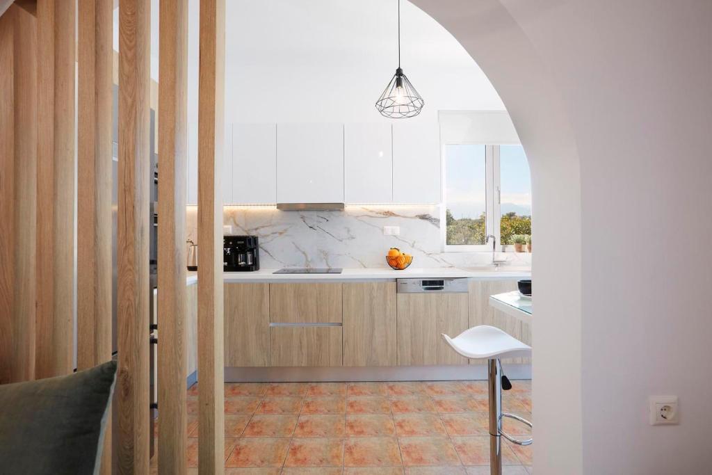A kitchen or kitchenette at Villa Amaranthus- Private Pool- Jacuzzi- mini Golf