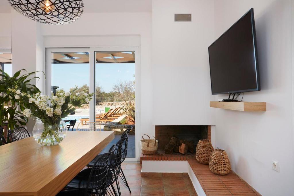 A television and/or entertainment centre at Villa Amaranthus- Private Pool- Jacuzzi- mini Golf