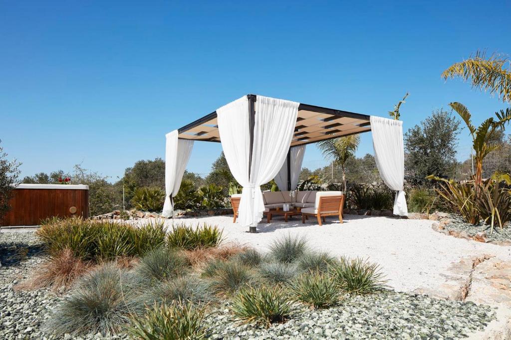 A garden outside Villa Amaranthus- Private Pool- Jacuzzi- mini Golf