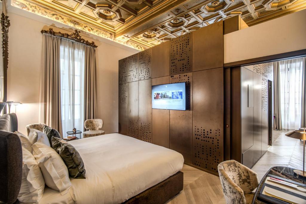 Postel nebo postele na pokoji v ubytování Martius Private Suites Hotel