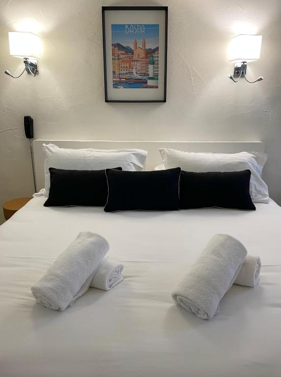 Postel nebo postele na pokoji v ubytování Hôtel Posta Vecchia