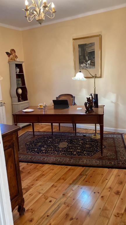 an office with a wooden desk in a room at Chez Hélène 3 étoiles, labellisé disabled PMR,pour 4 personnes chiens bienvenus-pet friendly in Bourg-Madame