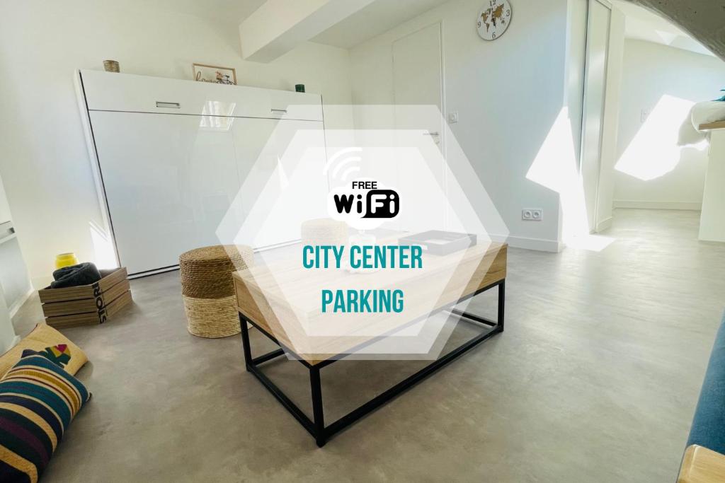 a city center parking sign on a table in a room at Nouveau - AuPetitSaumur in Saumur