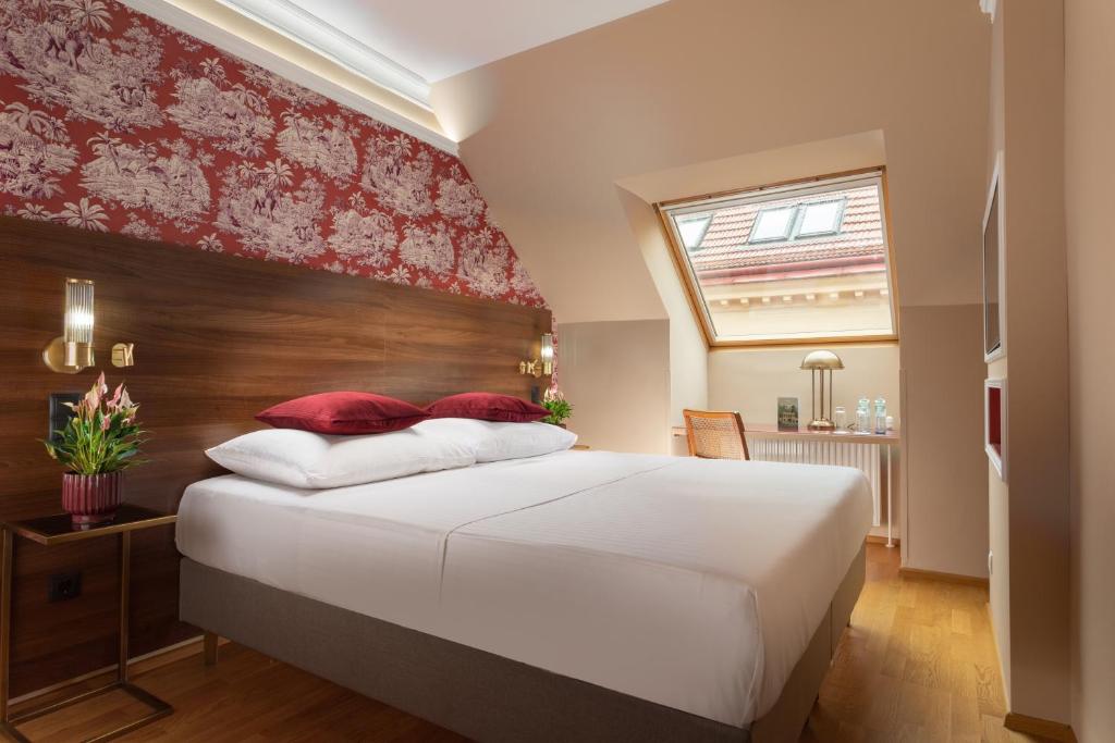 Postel nebo postele na pokoji v ubytování ARTIST Boutique Hotel