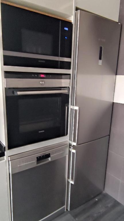 Kuchyň nebo kuchyňský kout v ubytování Apartament Melpomeny