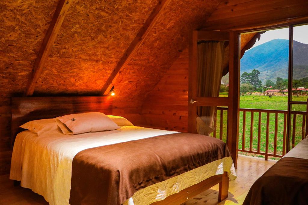Postel nebo postele na pokoji v ubytování Cabañas - Kobold Haus