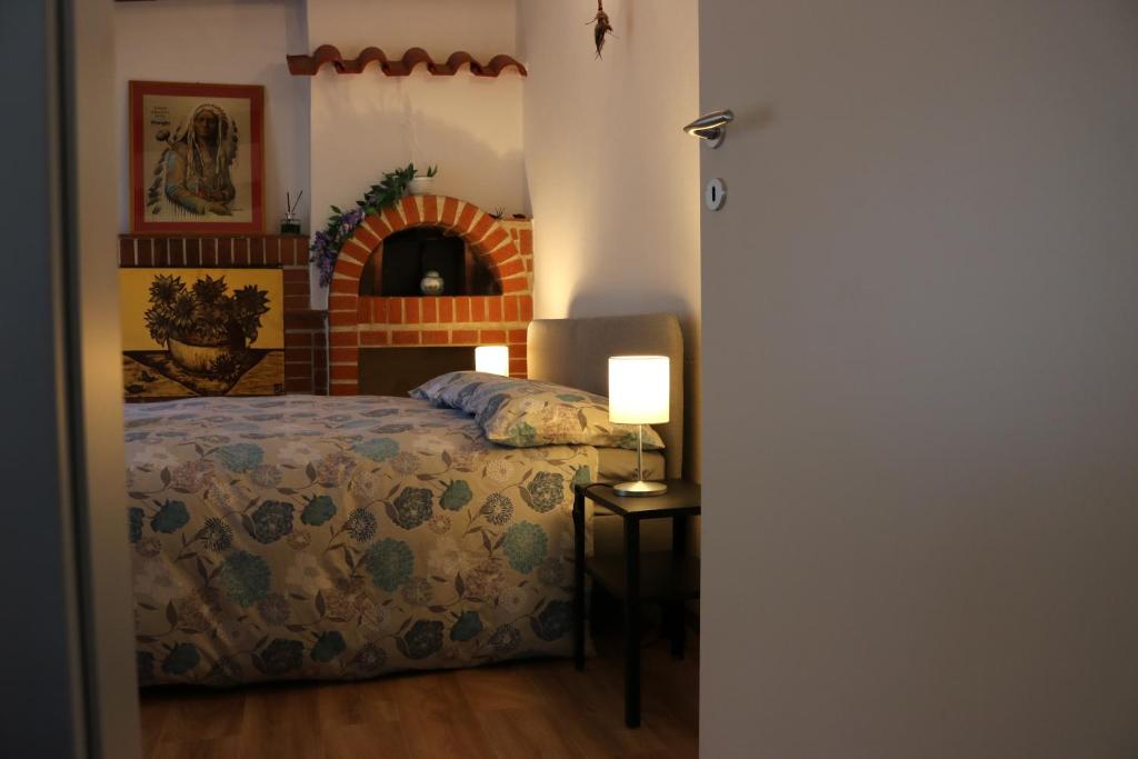 Giường trong phòng chung tại Appartamento Boscodisotto