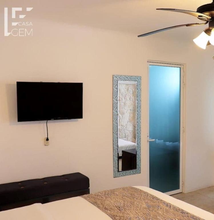 TV a/nebo společenská místnost v ubytování Casa Gem B&B