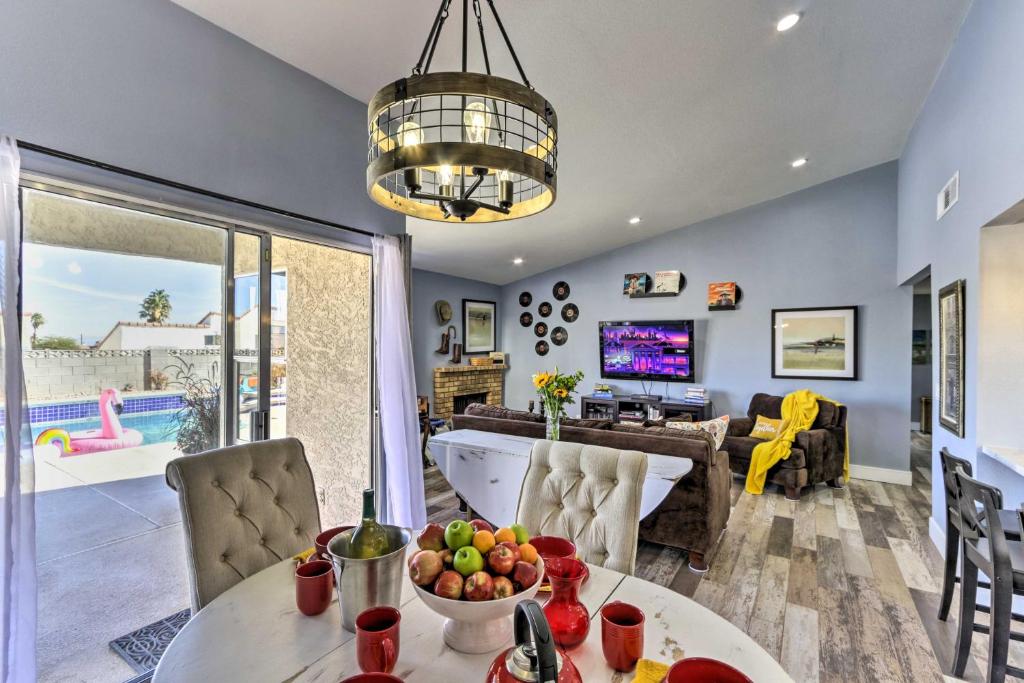 a living room with a table with a bowl of fruit at Las Vegas Oasis with Private Hot Tub and Pool! in Las Vegas