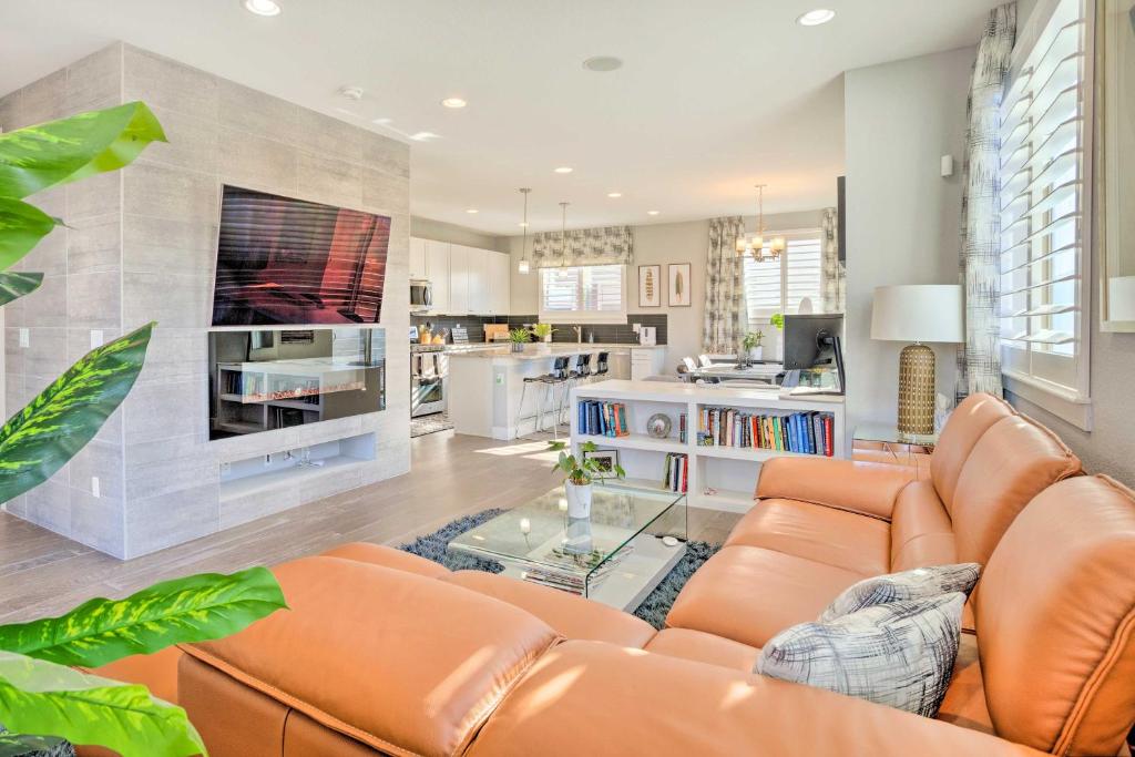 a living room with a couch and a fireplace at Private Balcony Pet-Friendly Denver Escape! in Denver