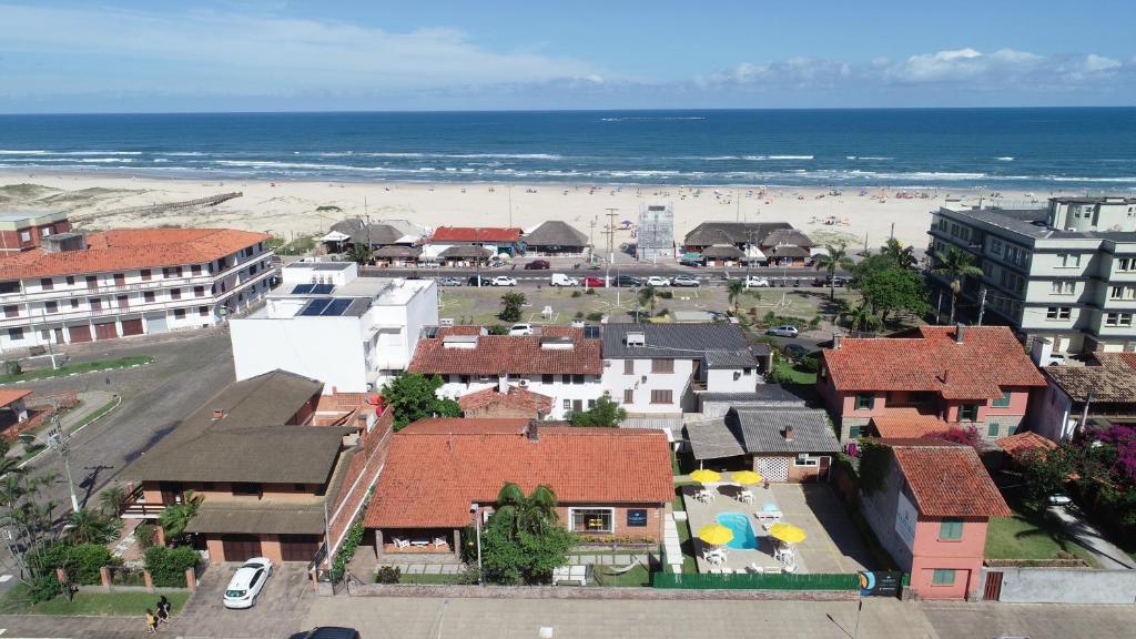 an aerial view of a town with a beach and buildings at Mare Blu - Pousada Hostel in Torres