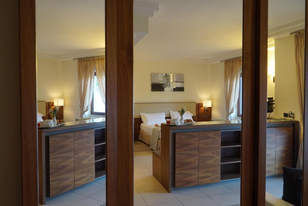 Postel nebo postele na pokoji v ubytování Suites & Residence Hotel